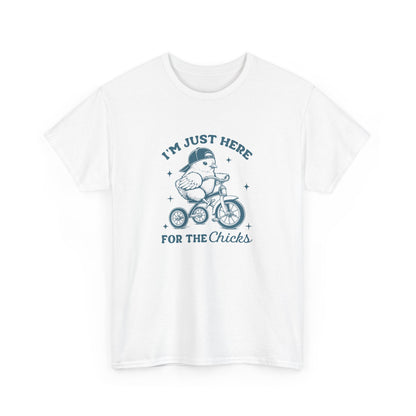 White Easter T-shirt showcasing a cute chick on a bicycle with a humorous "I'm Just Here for the Chicks" text, perfect for a lighthearted holiday outfit. Hop into the season in style and shop Easter shirts online today!