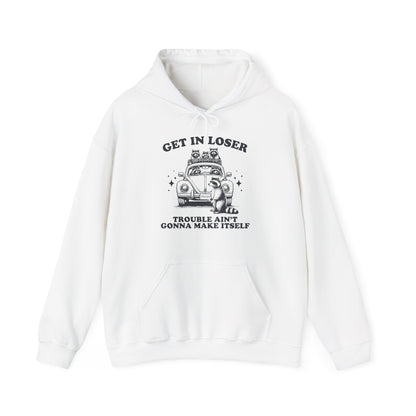 Front view of a white hoodie with "Get in Loser, Trouble Ain't Gonna Make Itself" in black letters and a group of raccoons riding in a car. Part of the Vivid Divergence Sensory Friendly Unisex Hoodie Range.