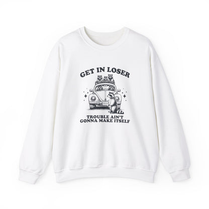 Front view of a white sweatshirt with "Get in Loser, Trouble Ain't Gonna Cause Itself" in black letters and a group of raccoons in a car. Part of the Vivid Divergence Sensory Friendly Unisex Sweater Jumper Range.