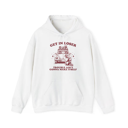 Front view of a white hoodie with "Get in Loser, Trouble Ain't Gonna Make Itself" in red letters and a group of raccoons riding in a car. Part of the Vivid Divergence Sensory Friendly Unisex Hoodie Range.