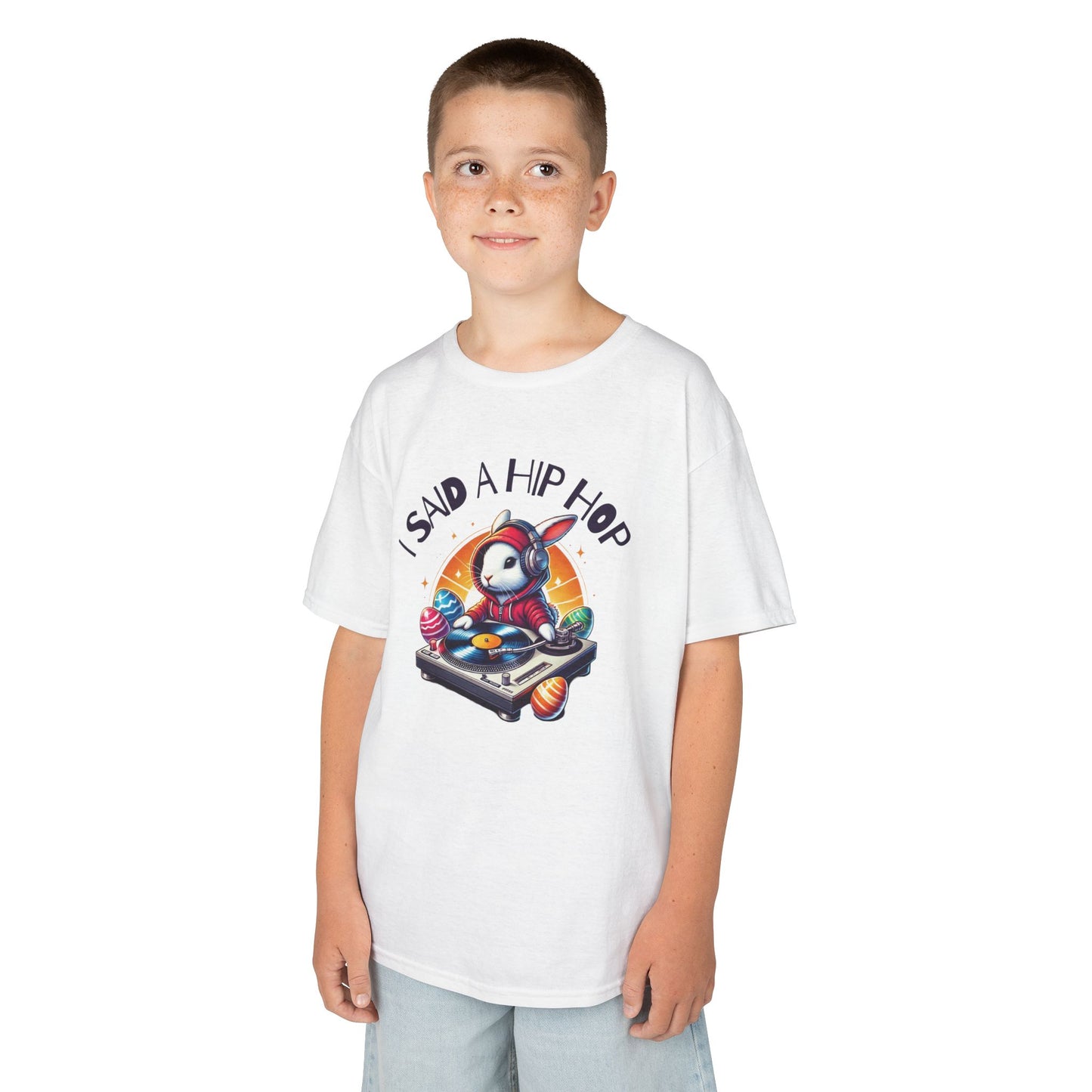 Child wearing a white Easter T-shirt featuring a funky rapping bunny with "I Said A Hip Hop" text, a fun and stylish choice. Hop into the season in style and shop Easter shirts online today!