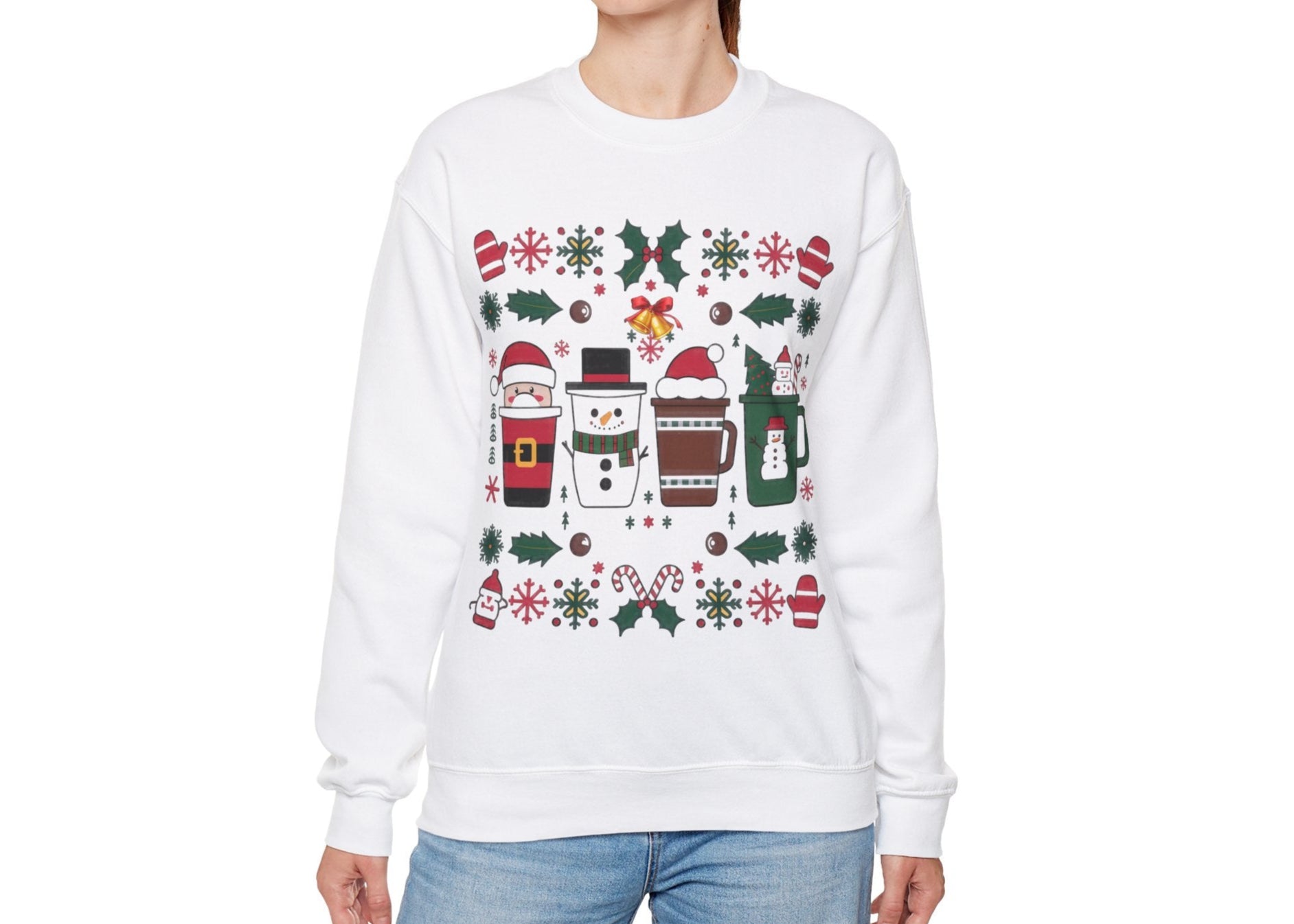 Model seated in a cozy setting wearing a white sweatshirt featuring a festive holiday pattern with coffee cups, snowflakes, and Christmas elements. Part of the Vivid Divergence Sensory Friendly Unisex Sweater Jumper Range.
