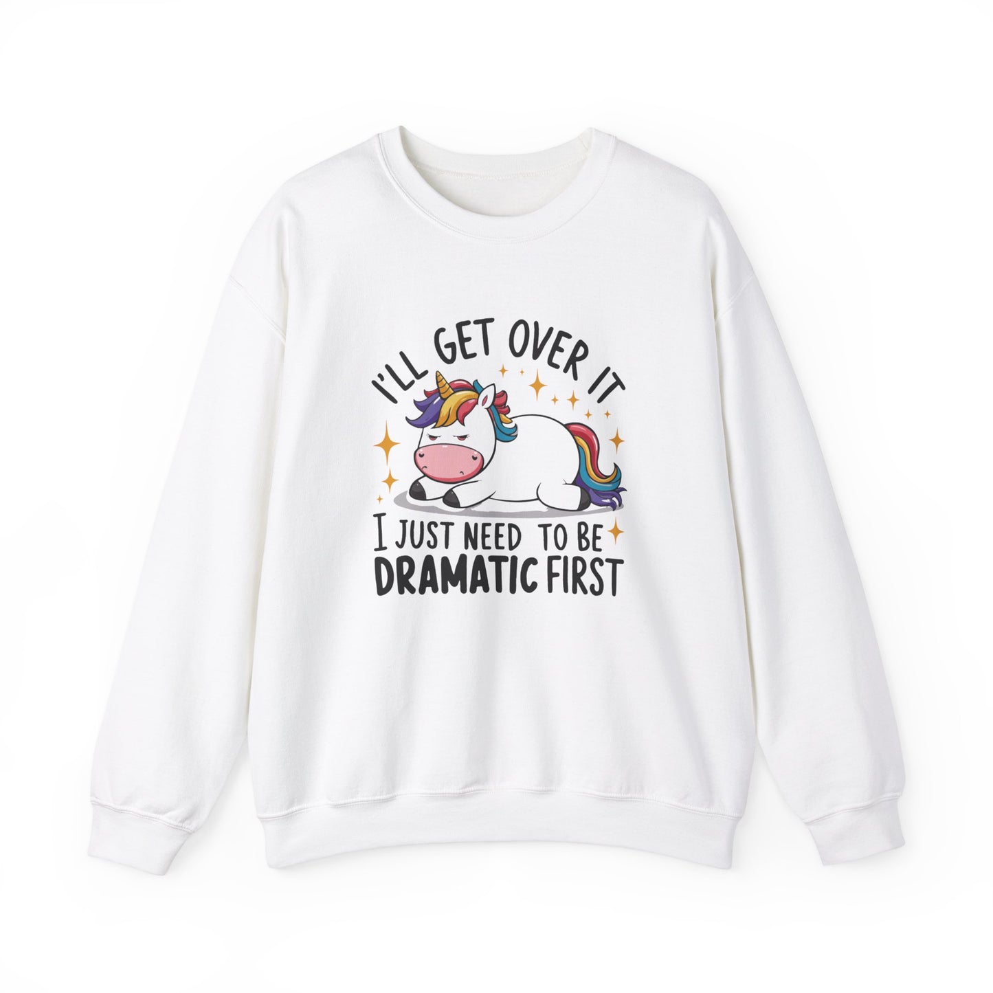 Front view of a white sweater jumper with the text "I’ll Get Over It, I Just Need To Be Dramatic First" and a cartoon unicorn lying on its side. Part of the Vivid Divergence Sensory Friendly Unisex Sweater Jumper Range.