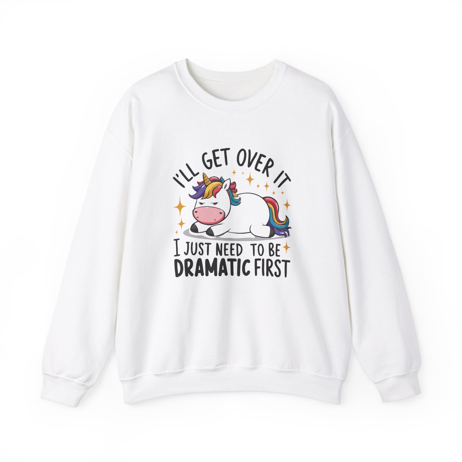 Front view of a white sweater jumper with the text "I’ll Get Over It, I Just Need To Be Dramatic First" and a cartoon unicorn lying on its side. Part of the Vivid Divergence Sensory Friendly Unisex Sweater Jumper Range.