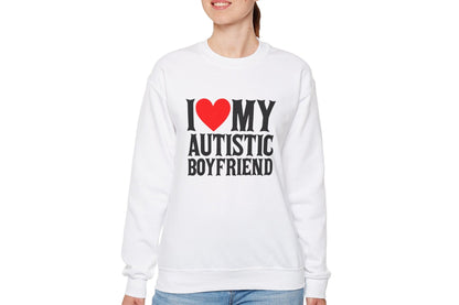 Model wearing a white sweater jumper with the text "I ❤️ My Autistic Boyfriend" in bold black and red lettering. Part of the Vivid Divergence Sensory Friendly Unisex Sweater Jumper Range.