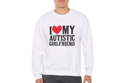 Model wearing a white sweater jumper with the text "I ❤️ My Autistic Girlfriend" in bold black and red lettering. Part of the Vivid Divergence Sensory Friendly Unisex Sweater Jumper Range.