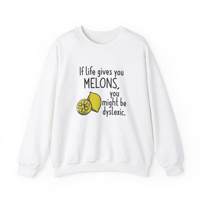 Front view of a white sweatshirt featuring an illustration of melons and the text "If Life Gives You Melons, You Might Be Dyslexic." Part of the Vivid Divergence Sensory Friendly Unisex Sweater Jumper Range.