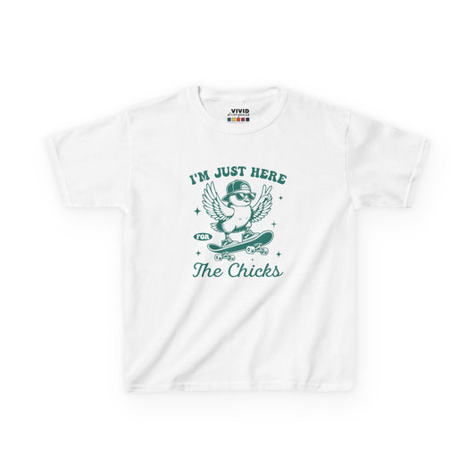 White kids' T-shirt featuring a playful "I'm Just Here for the Chicks" design with a cute chick illustration, perfect for Easter fun. Hop into the season in style and shop Easter shirts online today!