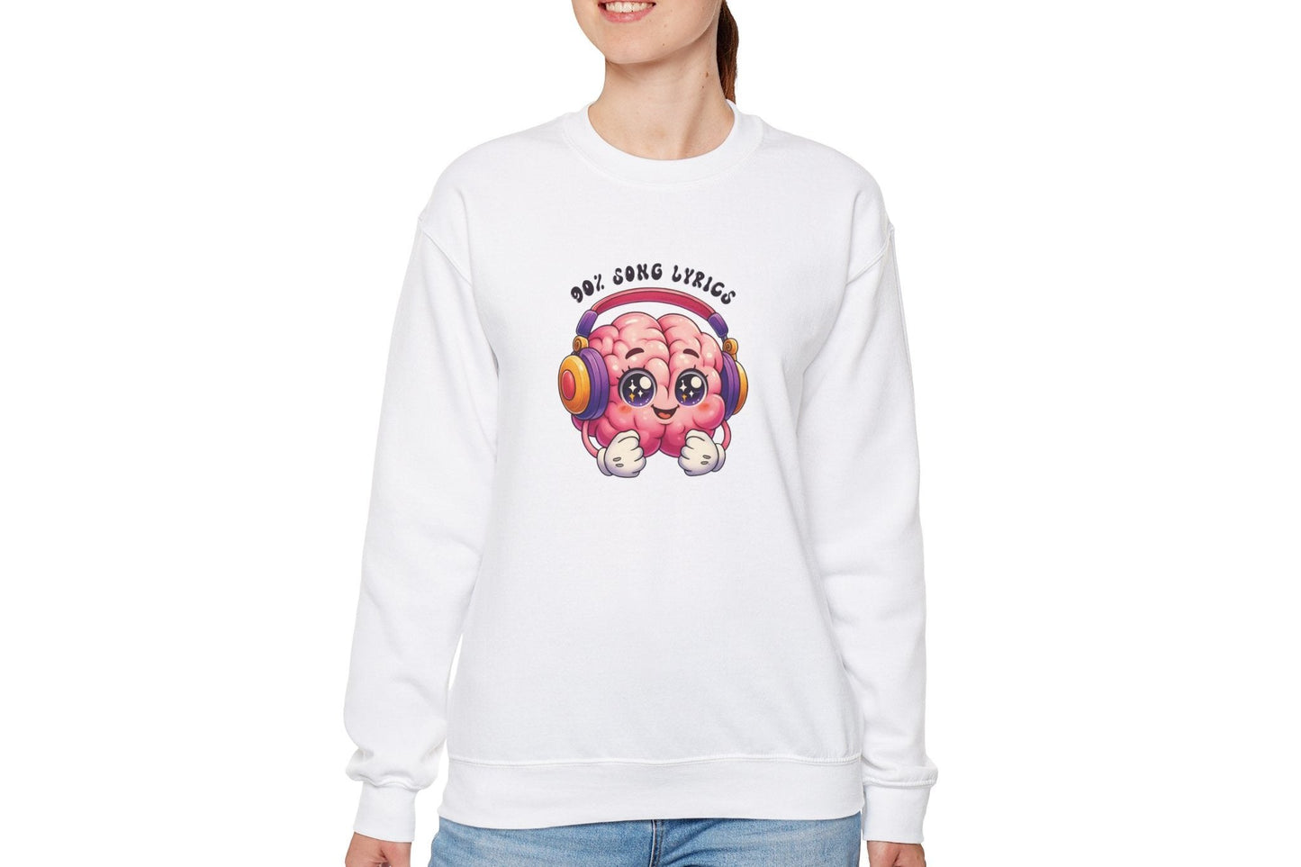 Model wearing a white sweater jumper with the text "My Brain is 90% Song Lyrics" and a cartoon brain illustration with musical notes. Part of the Vivid Divergence Sensory Friendly Unisex Sweater Jumper Range.