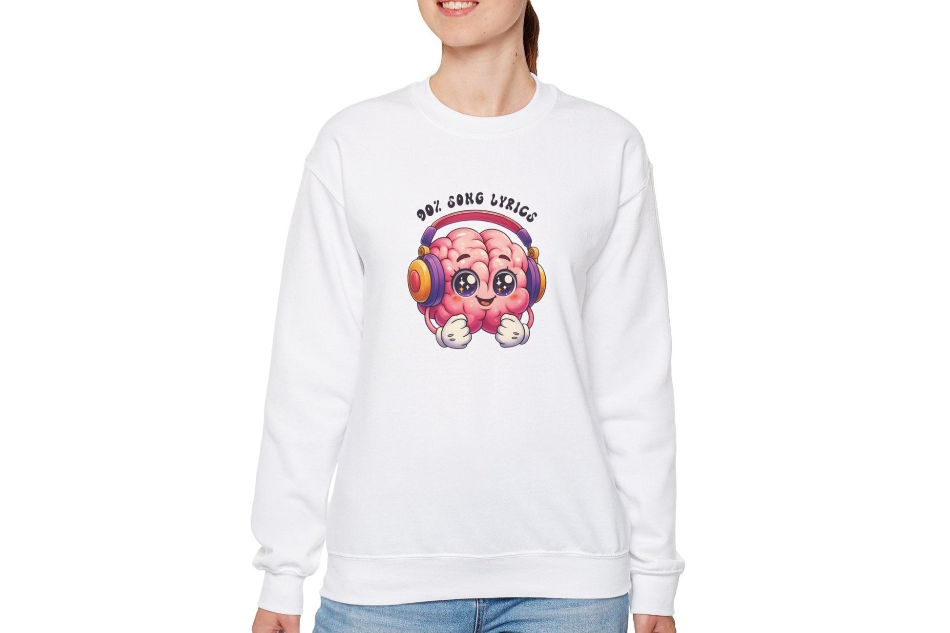 Model wearing a white sweater jumper with the text "My Brain is 90% Song Lyrics" and a cartoon brain illustration with musical notes. Part of the Vivid Divergence Sensory Friendly Unisex Sweater Jumper Range.