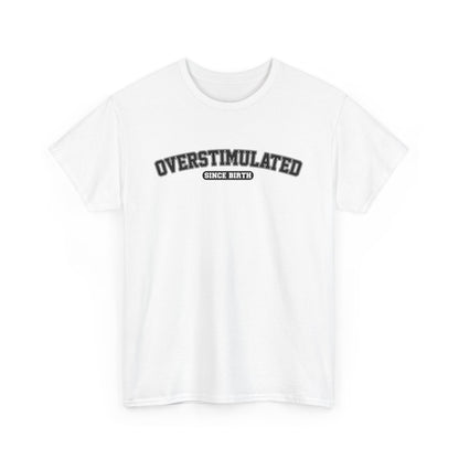 Front view of a white T-shirt with "Overstimulated Since Birth" in bold black text. Part of the Vivid Divergence Sensory Friendly Unisex Tees Range.