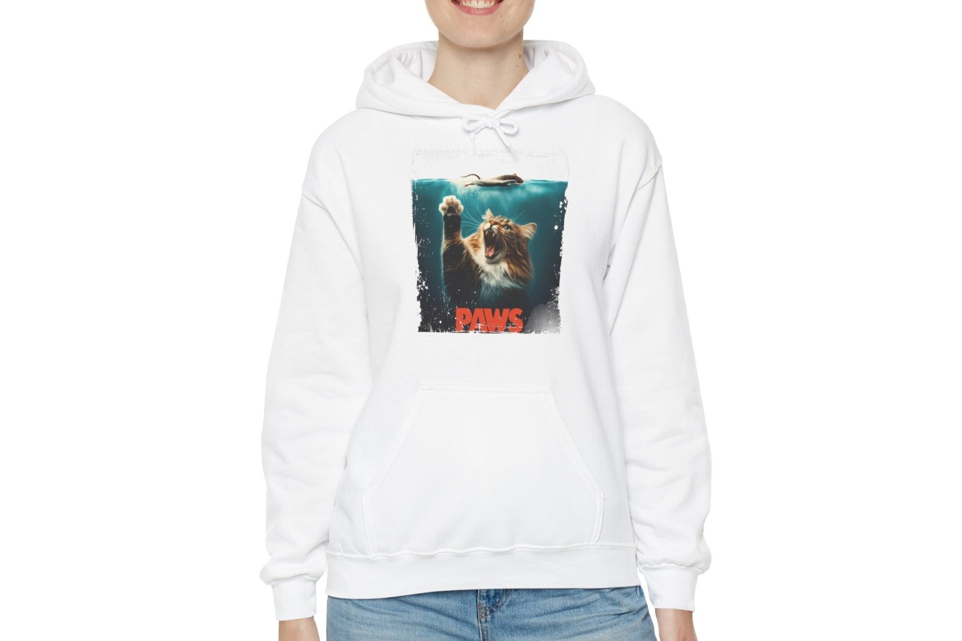 Model wearing a white hoodie featuring a Jaws parody design with a cat’s paw reaching toward a swimmer and the text "Paws." Part of the Vivid Divergence Sensory Friendly Unisex Hoodie Range.