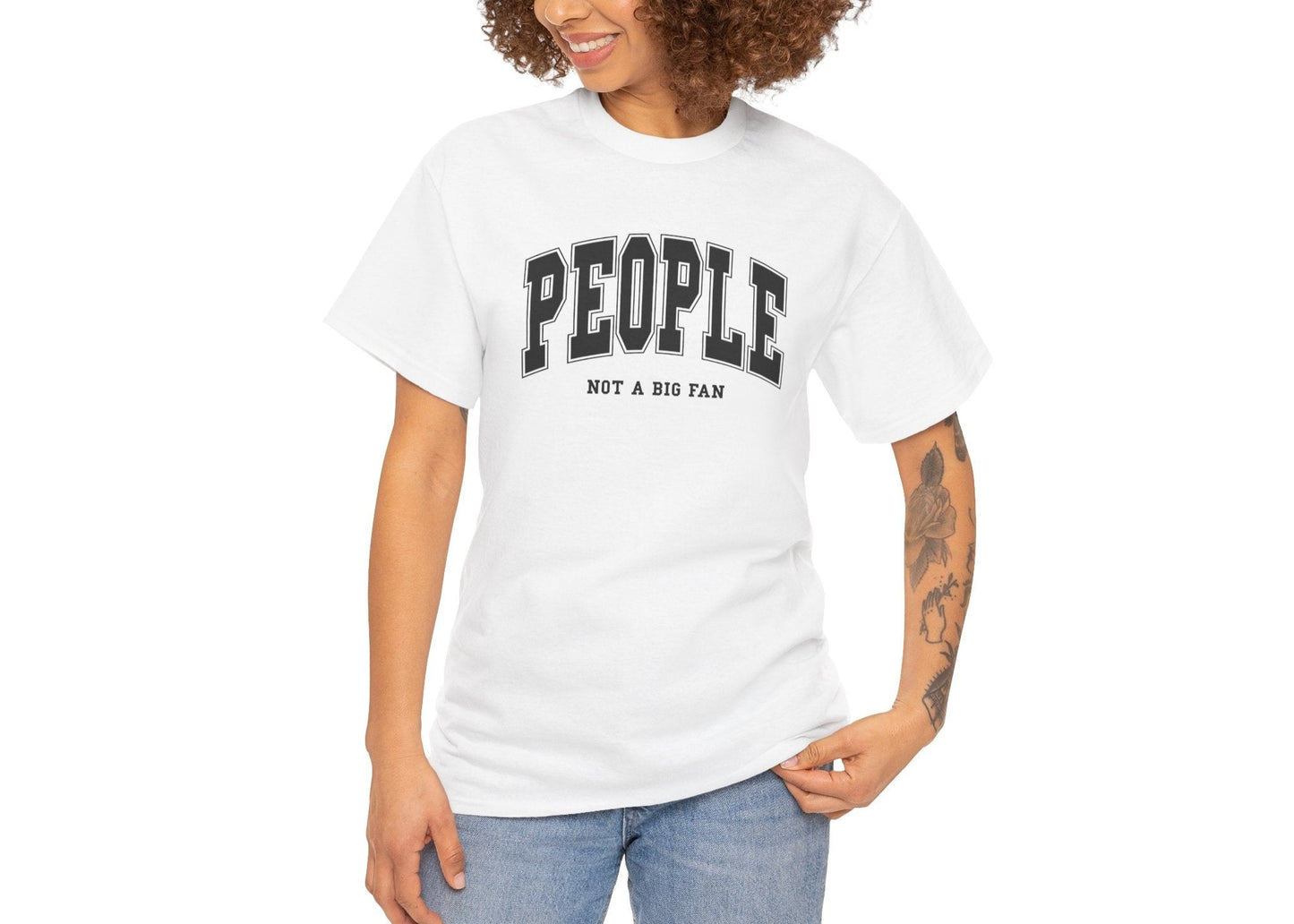 Model wearing a white T-shirt with "People, Not a Big Fan" in bold white text. Part of the Vivid Divergence Sensory Friendly Unisex Tees Range.