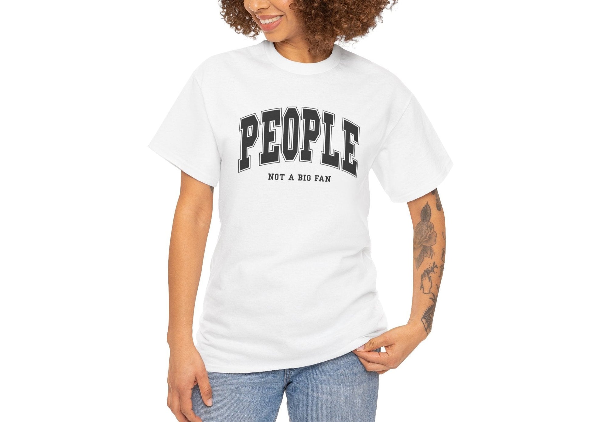 Model wearing a white T-shirt with "People, Not a Big Fan" in bold white text. Part of the Vivid Divergence Sensory Friendly Unisex Tees Range.