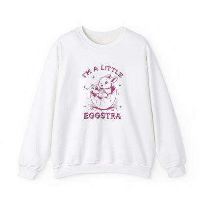 Front view of white sweater jumper with pink “I’m a Little Eggstra” Easter bunny design. Part of the Vivid Divergence Sensory Friendly Unisex Sweater Jumper Range.
