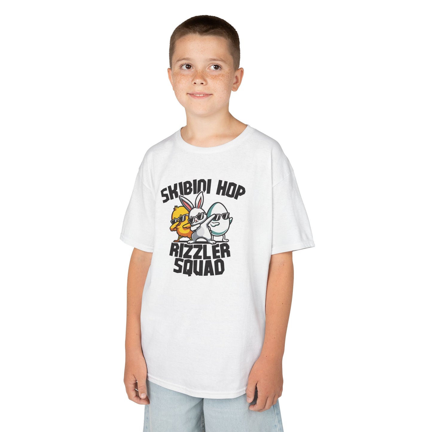 Child wearing a white Easter T-shirt with "Skibidi Hop Rizzler Squad" text, a funny and stylish Easter meme outfit. Hop into the season in style and shop Easter shirts online today!