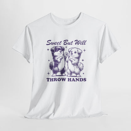 Hanging white T-shirt featuring "Sweet But Will Throw Hands" text with two dogs in purple-tone design. Part of the Vivid Divergence Sensory Friendly Unisex Tees Range.