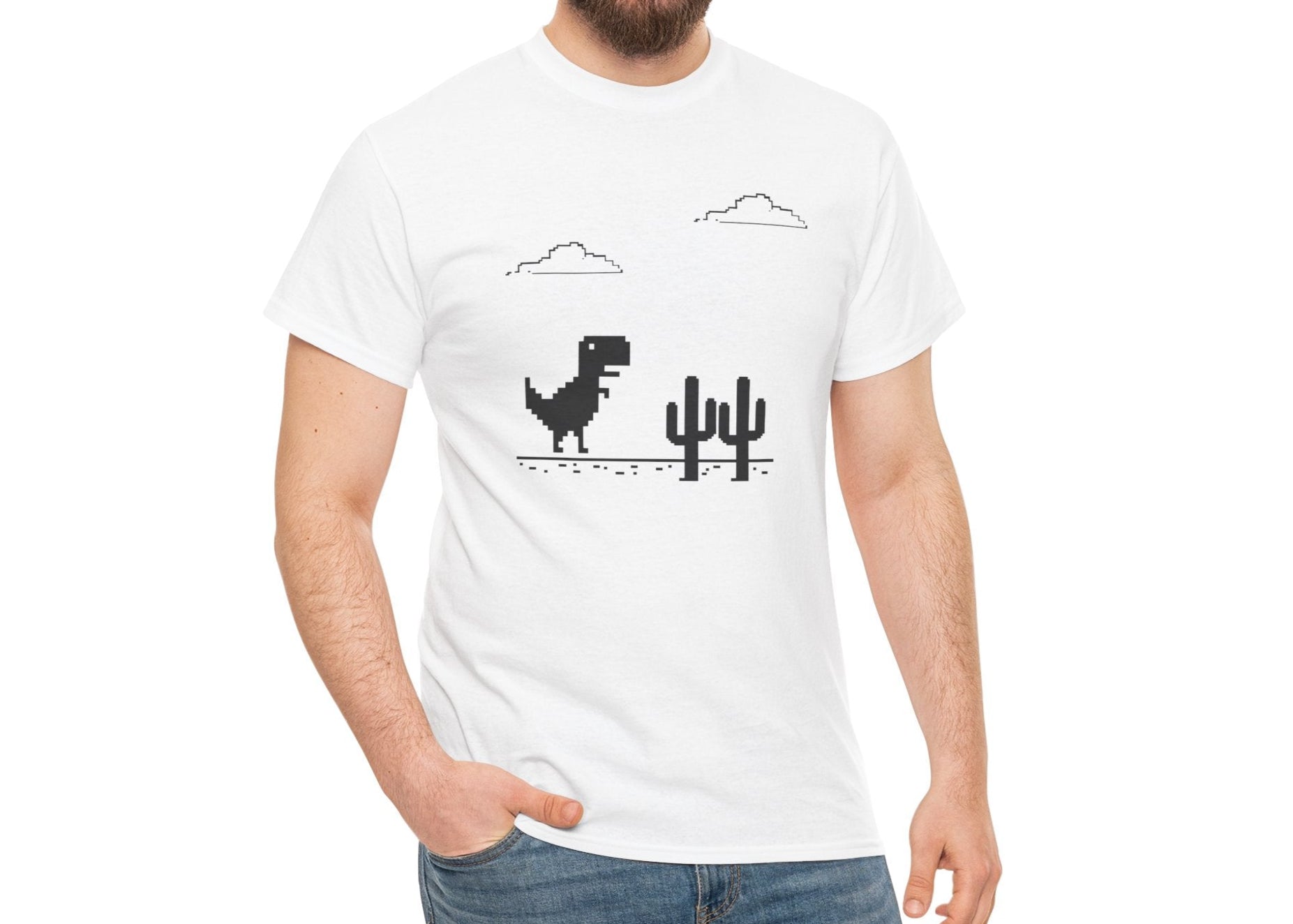 Model wearing a white T-shirt featuring a minimalist pixel-style T-Rex Runner Dinosaur Game design with a T-Rex, cacti, and clouds. Part of the Vivid Divergence Sensory Friendly Unisex Tees Range.