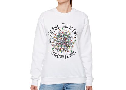 Model wearing a white sweatshirt featuring a humorous tangled Christmas lights design with the phrase "I'm Fine. This is Fine. Everything's Fine." Part of the Vivid Divergence Sensory Friendly Sweatshirt Range.