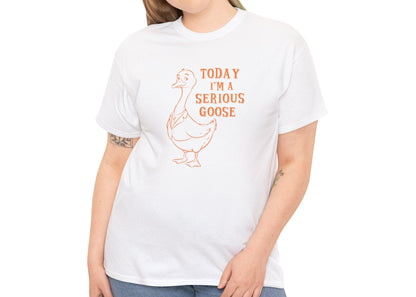 Model wearing a white T-shirt with "Today I'm A Serious Goose" in orange text and a simple goose illustration. Part of the Vivid Divergence Sensory Friendly Unisex Tees Range.