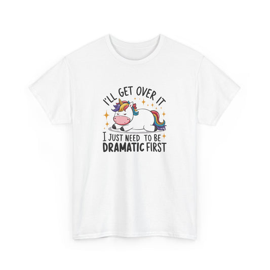 Front view of a white T-shirt featuring a unicorn and cow graphic with the text "I'll Get Over It, I Just Need To Be Dramatic First." Part of the Vivid Divergence Sensory Friendly Unisex Tees Range.