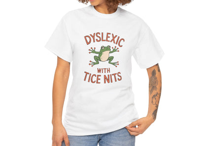 White T-shirt with a green frog and "Dyslexic with Tice Nits" text modeled on a person. Part of the Vivid Divergence Sensory Friendly Unisex Tees Range.