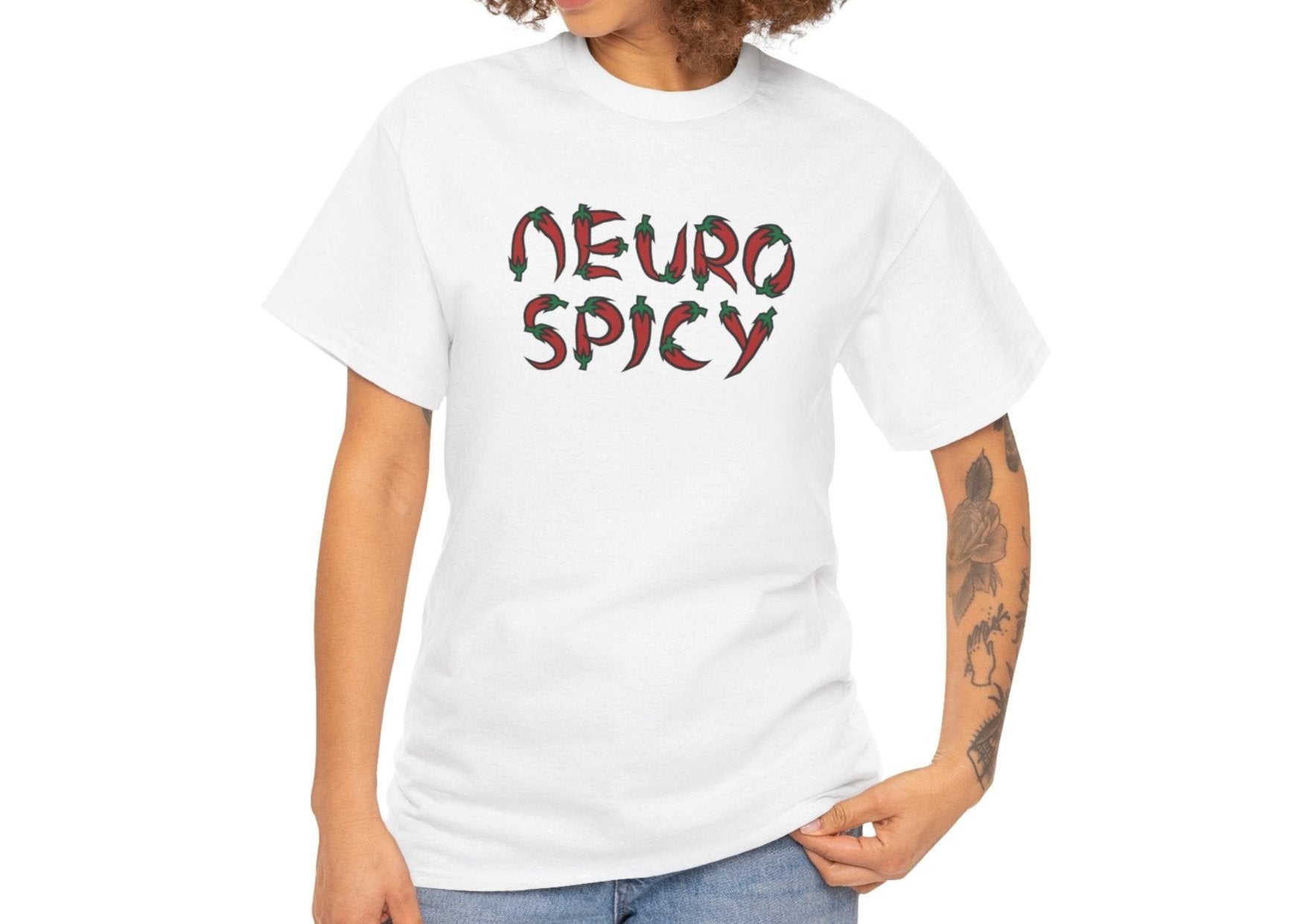 Model wearing a white T-shirt with "Neuro Spicy" text, styled casually with jeans. Part of the Vivid Divergence Sensory Friendly Unisex Tees Range.
