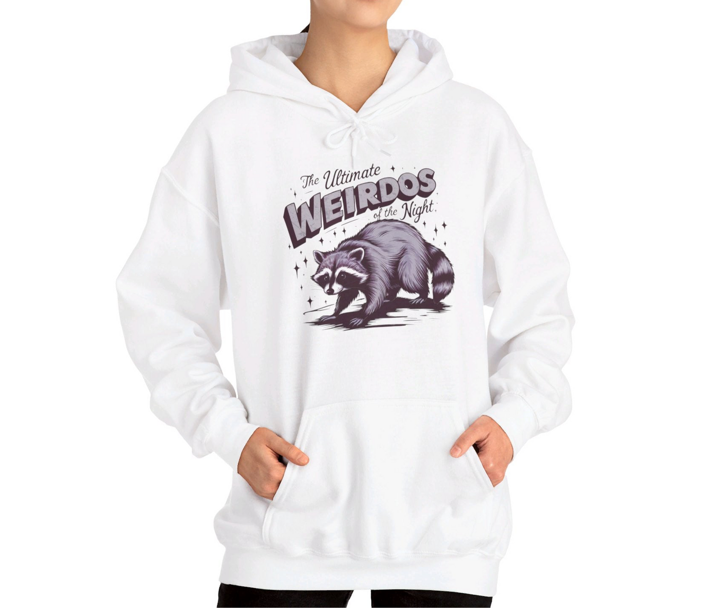 Model wearing a white hoodie featuring the text "The Ultimate Weirdos of the Night" with a cartoon illustration of a raccoon and an opossum. Part of the Vivid Divergence Sensory Friendly Unisex Hoodie Range.
