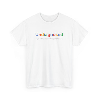 Front view of a white T-shirt with the text "Undiagnosed" styled in the Google logo font and colors, followed by the phrase "A Comprehensive Self-Diagnosis." Part of the Vivid Divergence Sensory Friendly Unisex Tees Range.
