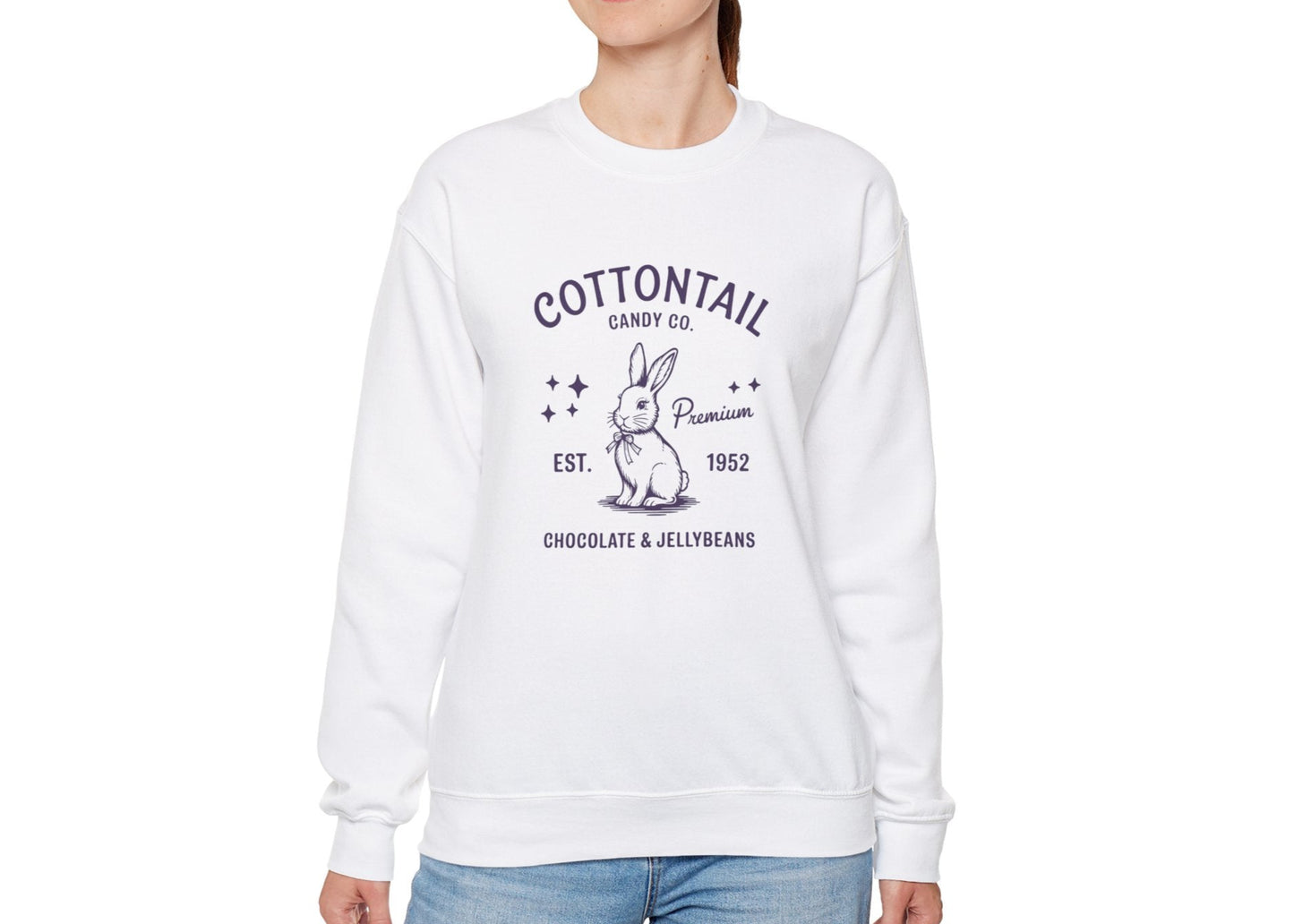Woman wearing white sweater jumper with retro-style Cottontail Candy Co Easter bunny print. Part of the Vivid Divergence Sensory Friendly Unisex Sweater Jumper Range.
