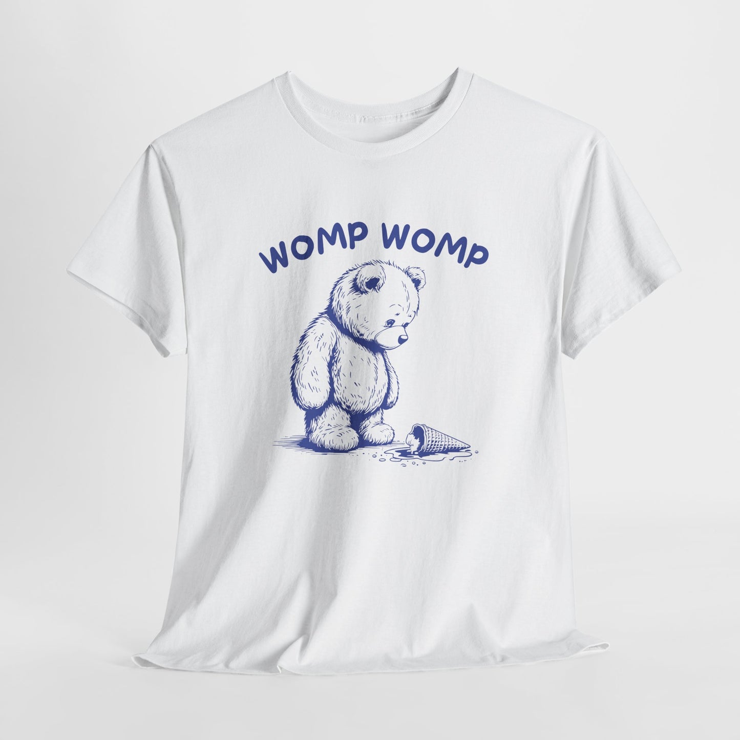 Hanging white T-shirt featuring "Womp Womp" text with a sad bear looking at a dropped ice cream cone in navy blue-tone design. Part of the Vivid Divergence Sensory Friendly Unisex Tees Range.