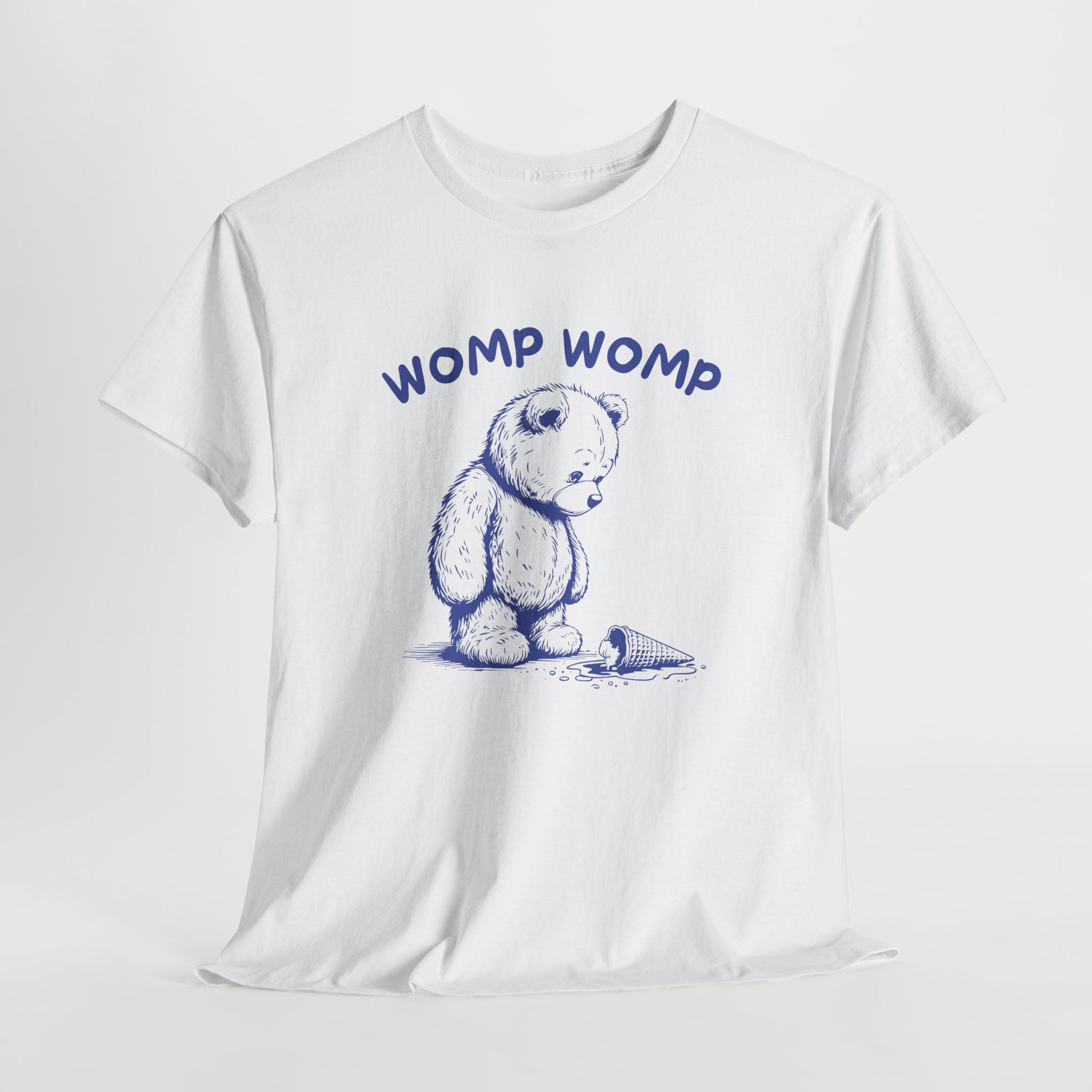 Hanging white T-shirt featuring "Womp Womp" text with a sad bear looking at a dropped ice cream cone in navy blue-tone design. Part of the Vivid Divergence Sensory Friendly Unisex Tees Range.