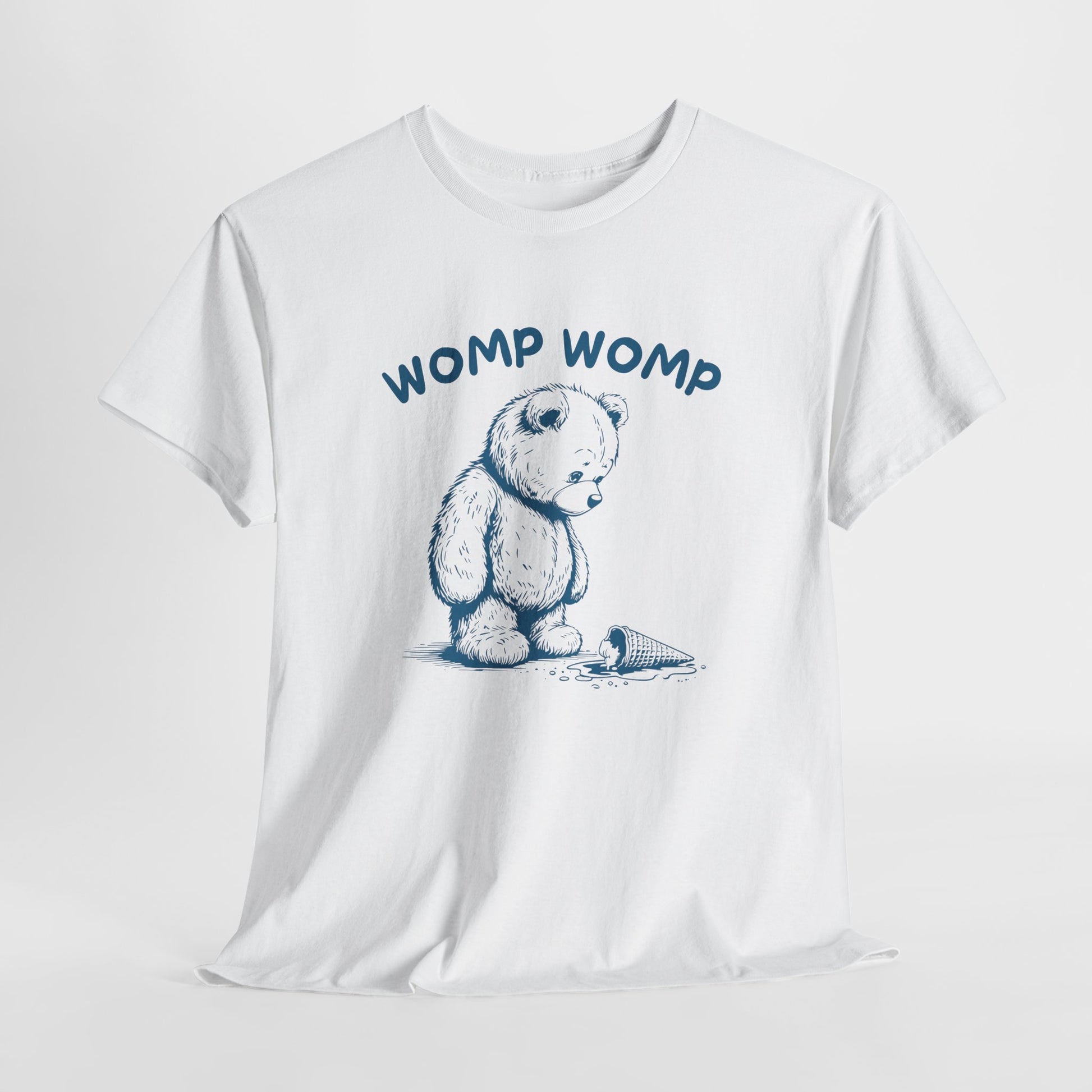 Hanging white T-shirt featuring "Womp Womp" text with a sad bear looking at a dropped ice cream cone. Part of the Vivid Divergence Sensory Friendly Unisex Tees Range.