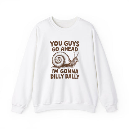 Front view of a white sweater jumper featuring the text "You Guys Go Ahead, I’m Gonna Dilly Dally" and a cartoon snail illustration. Part of the Vivid Divergence Sensory Friendly Unisex Sweater Jumper Range.