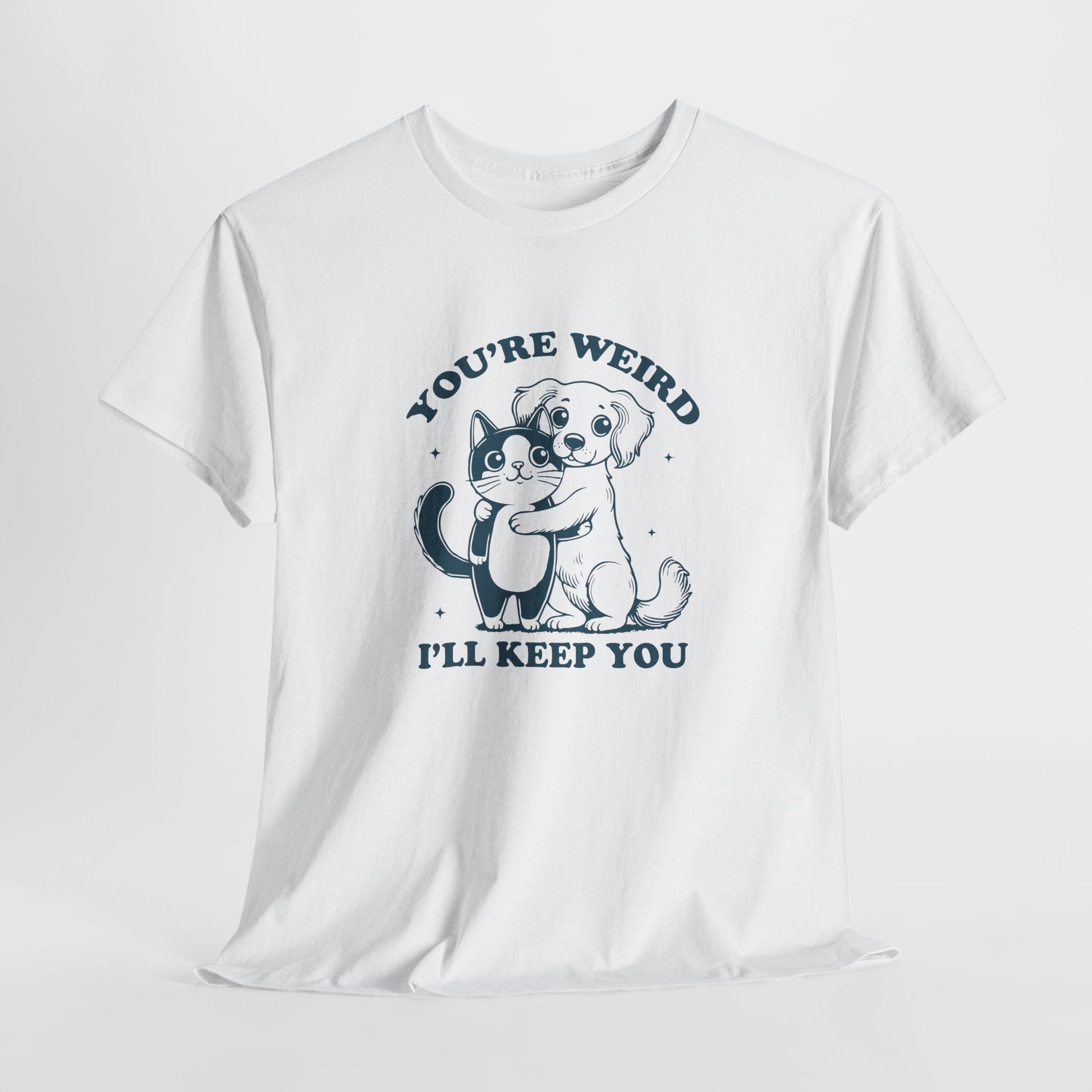 Hanging white T-shirt with a "You're Weird, I'll Keep You" design featuring a dog hugging a cat in black. Part of the Vivid Divergence Sensory Friendly Unisex Tees Range.