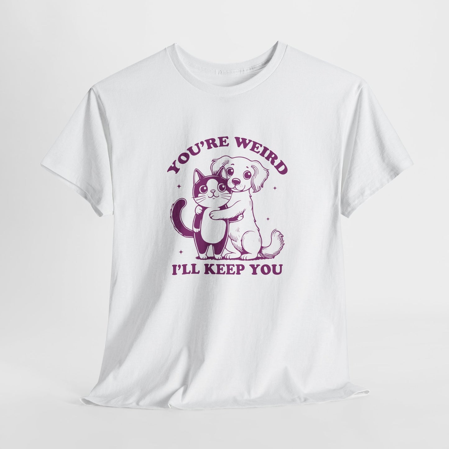 Hanging white T-shirt with a "You're Weird, I'll Keep You" design featuring a dog hugging a cat in purple. Part of the Vivid Divergence Sensory Friendly Unisex Tees Range.