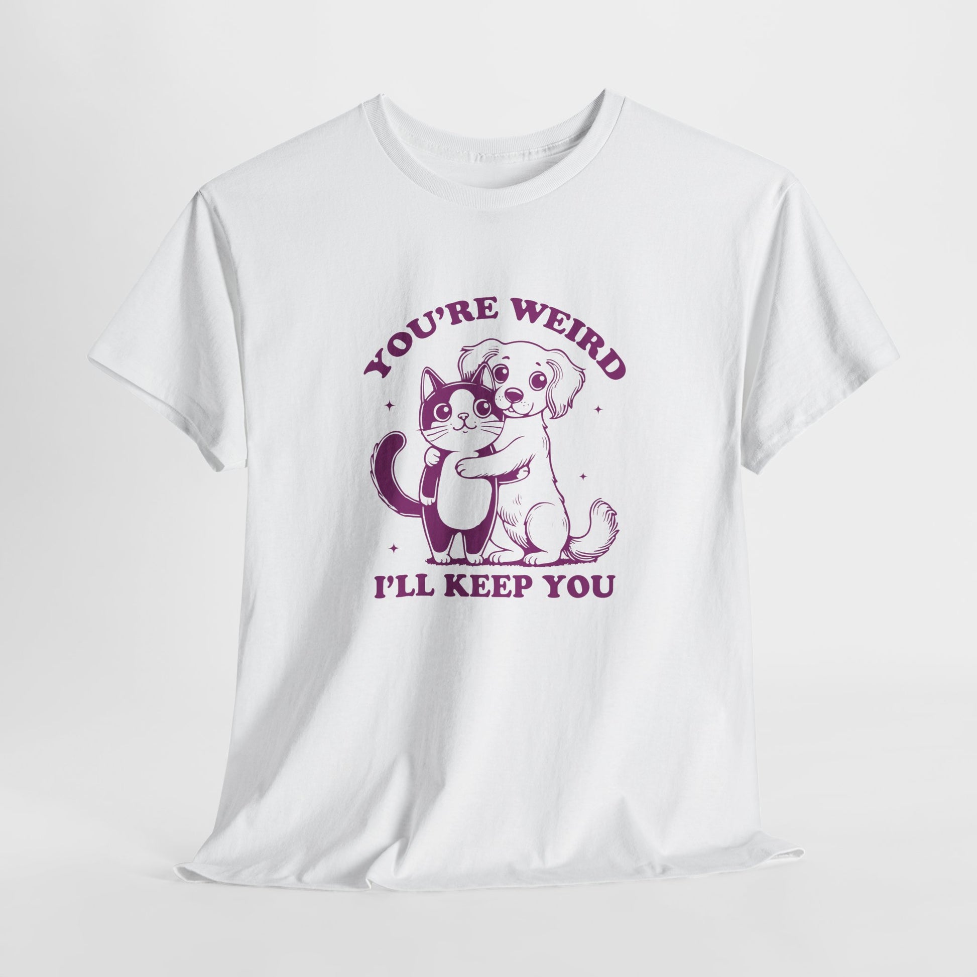 Hanging white T-shirt with a "You're Weird, I'll Keep You" design featuring a dog hugging a cat in purple. Part of the Vivid Divergence Sensory Friendly Unisex Tees Range.