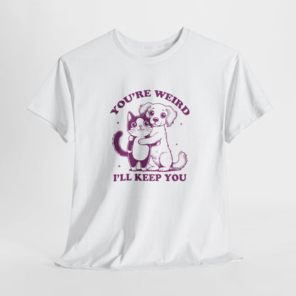Hanging white T-shirt with a "You're Weird, I'll Keep You" design featuring a dog hugging a cat in purple. Part of the Vivid Divergence Sensory Friendly Unisex Tees Range.