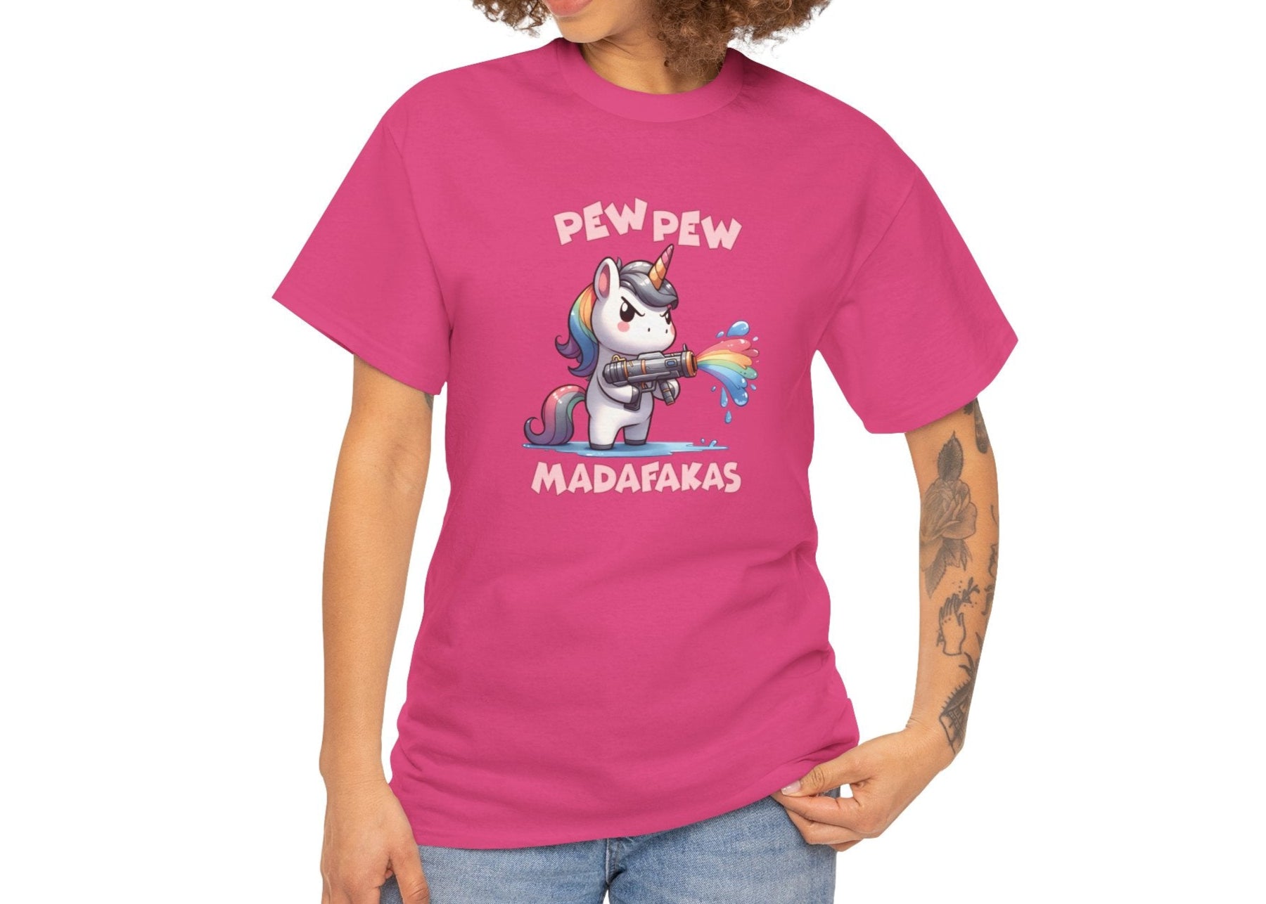 Woman wearing a pink T-shirt with a "Pew Pew Madafakas" unicorn graphic, styled casually. Part of the Vivid Divergence Sensory Friendly Unisex Tees Range.
