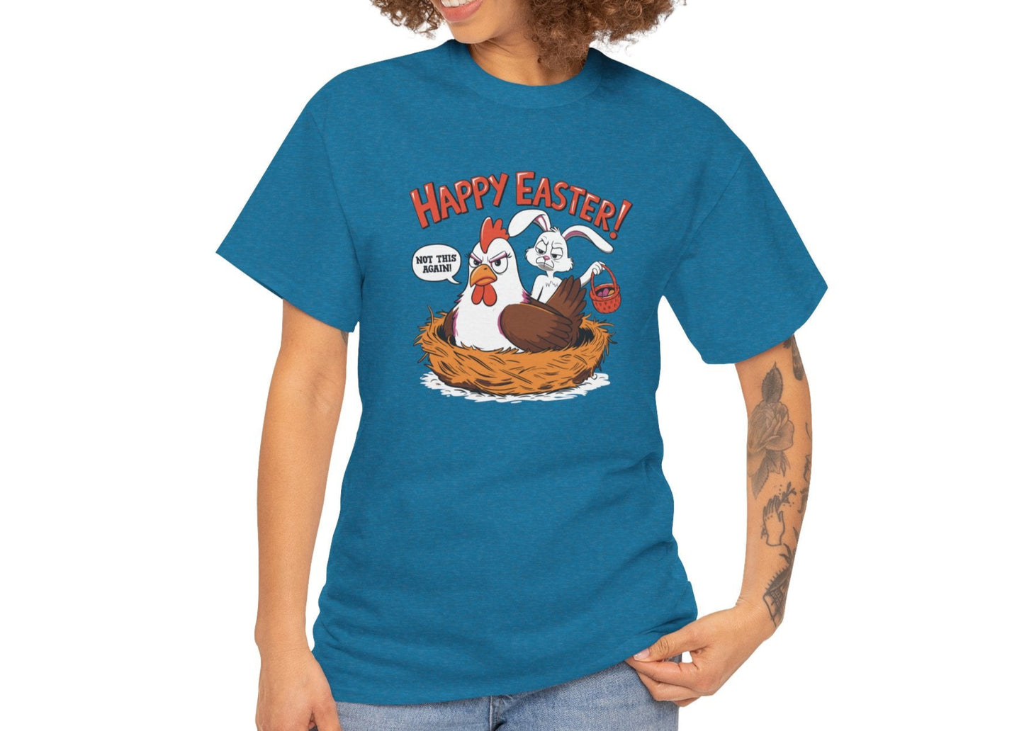 Woman wearing an antique sapphire Easter T-shirt decorated with a mischievous bunny caught in a hen’s nest, perfect for spreading laughs. Hop into the season in style and shop Easter shirts online today!
