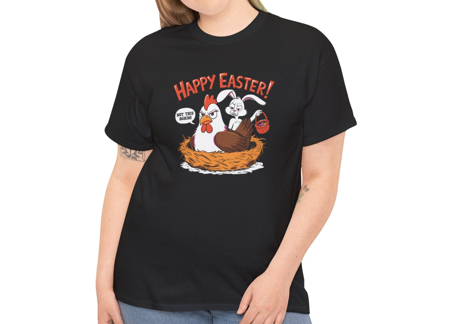 Woman wearing a black Easter T-shirt featuring a guilty bunny in a hen’s nest with "Happy Easter" text, a hilarious holiday outfit. Hop into the season in style and shop Easter shirts online today!

