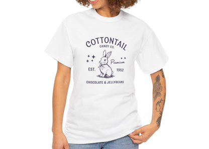 Woman wearing a white Easter T-shirt featuring a vintage "Cottontail Candy Co." bunny logo, a charming and nostalgic holiday style. Hop into the season in style and shop Easter shirts online today!