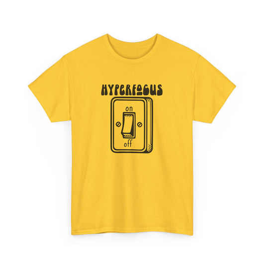 Front view of a yellow T-shirt with the text "Hyperfocus" and an on/off switch graphic design. Part of the Vivid Divergence Sensory Friendly Unisex Tees Range.