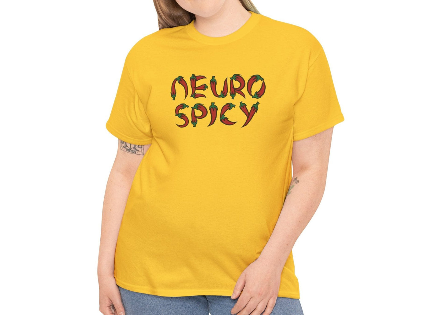 Model wearing a yellow T-shirt with "Neuro Spicy" text, styled casually with jeans. Part of the Vivid Divergence Sensory Friendly Unisex Tees Range.
